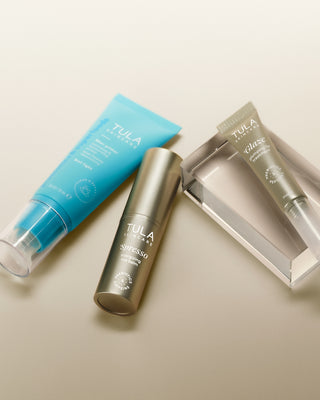 Tula skincare products on a beige background