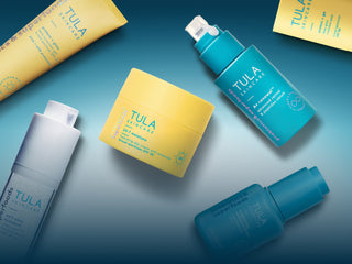 Tula skincare products on a gradient blue background
