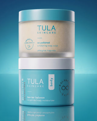 Tula products stacked on top of each other on blue background. 