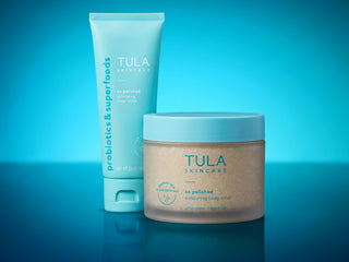 TULA So Polished Exfoliating Scrubs on blue background. 