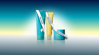 Three tubes of 'Nourish' skincare products on a gradient blue and green background