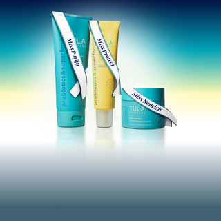 Three Tula skincare products on a gradient background