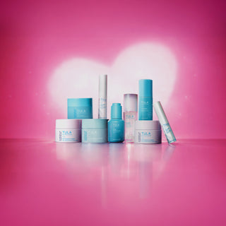 Tula skincare products on a pink background with a heart shape.
