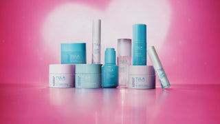 Tula skincare products on a pink background