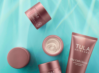 Tula skincare products on a light blue background