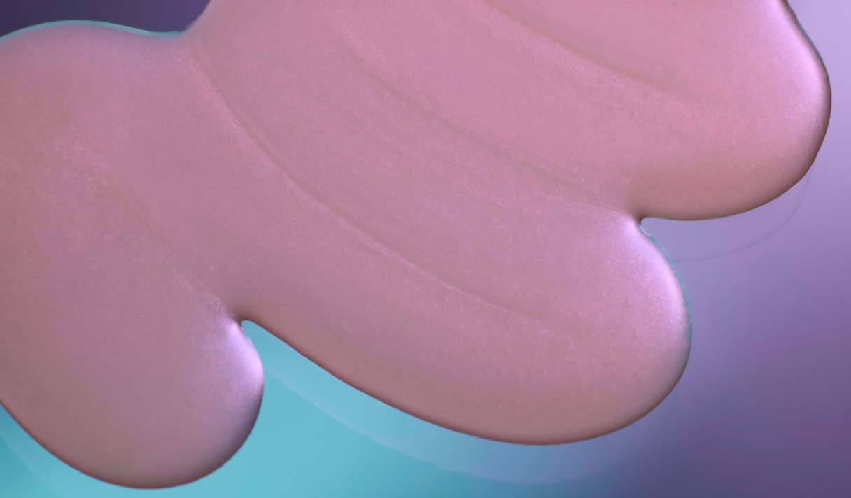Close-up of a pink silicone pad with a gradient background