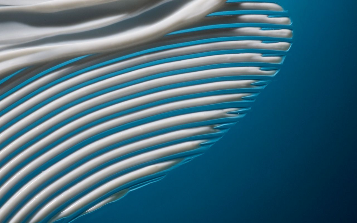 Close-up of white wavy lines on a blue background