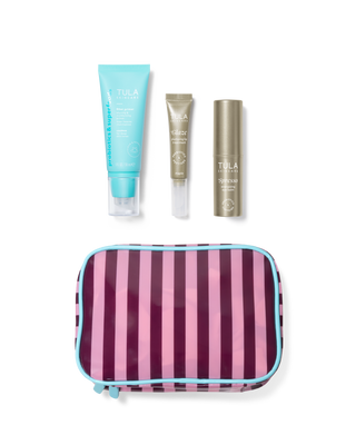 Set of Tula skincare products with a striped pouch on a transparent background