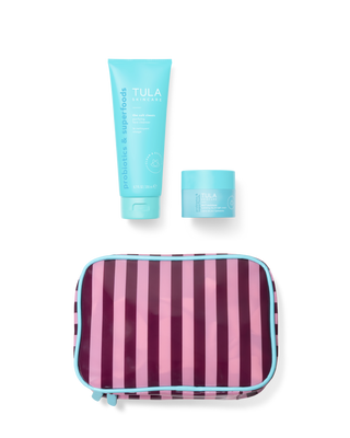 Two TULA skincare products with a striped pouch on a transparent background