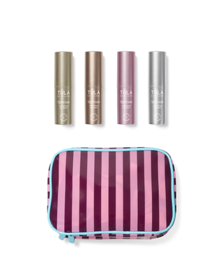 Set of Tula products including four cylindrical bottles and a striped pouch on a transparent background