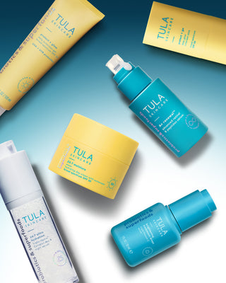 Tula skincare products on a gradient blue and white background