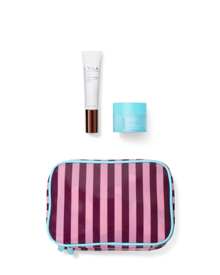 Striped travel pouch with TULA skincare products on a transparent background