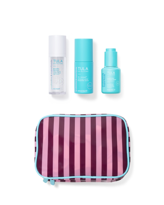 Tula skincare products including bottles and a striped pouch on a white background
