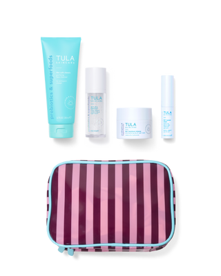 Tula skincare products including a tube, bottle, and jar with a striped pouch on a white background.