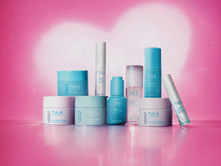 Tula skincare products on a pink background