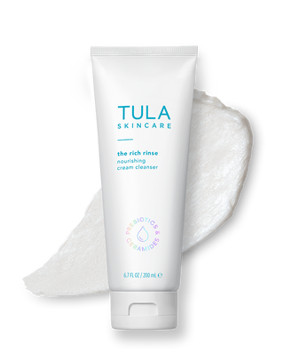 Tula Skincare cream cleanser with a sample of cleansed skin on a white background
