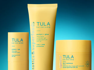 Tula Skincare products on a gradient blue background