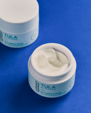 Tula skincare product on a blue background