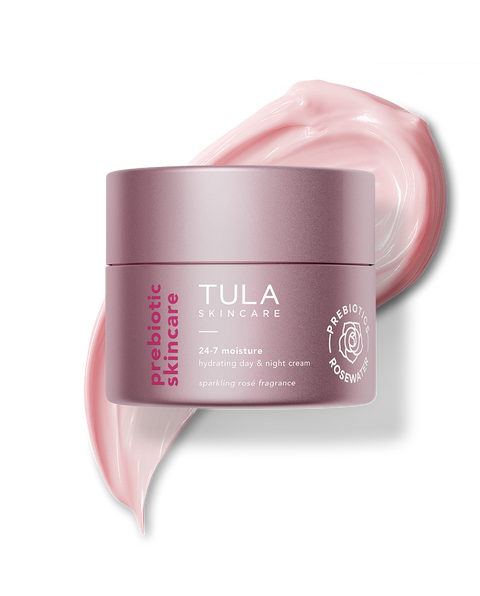 Tula skincare cream jar with pink cream swatch on a white background