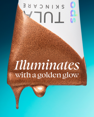 Tula Skincare product with a golden glow on a blue background