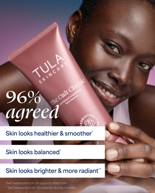 Woman holding a Tula Skincare product with text on skin benefits