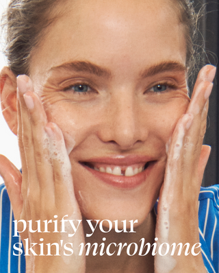Woman applying a skincare product with text 'purify your skin's microbiome' on a dark background