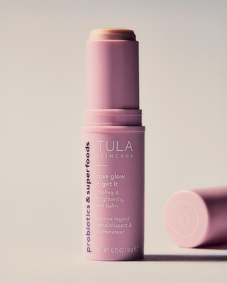 TULA x Amber Massey Skincare Bundle. A 4-piece cleansing and hydrating routine powered by probiotic extracts. Rose Glow + Get It Cooling and Brightening Eye Balm displayed.