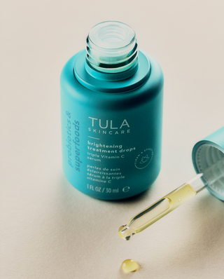 TULA Wake Up + Glow - A Vitamin-C packed antioxidant brightening duo featuring Bright Start and Brightening Treatment Drops. Product packaging displayed.