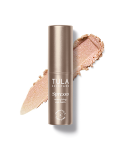 Tula Skincare 'Spesso' eye balm with a swatch on a white background
