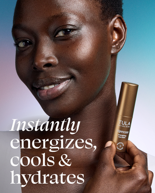 Woman holding a Tula skincare product with text about product benefits on a gradient background