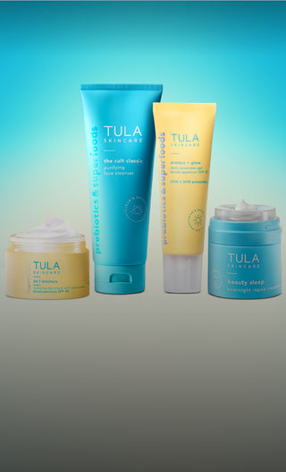 Tula skincare products on a gradient blue and gray background
