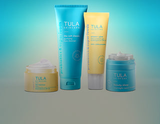 Tula skincare products on a gradient background