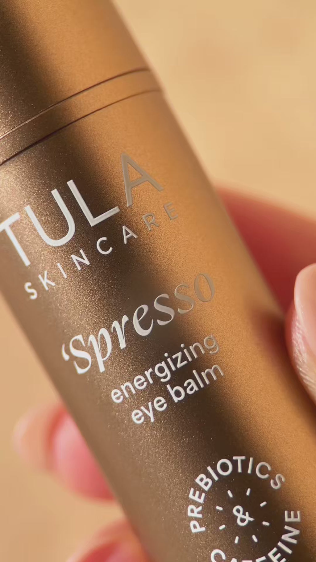 'Spresso energizing eye balm being applied to the undereye area